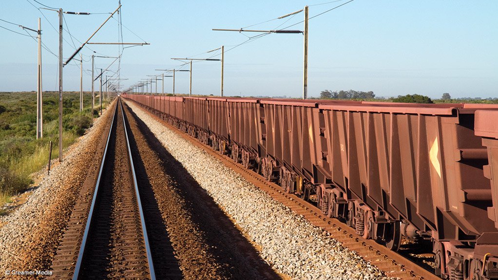 Transnet OREX locomotive leading a loaded consist